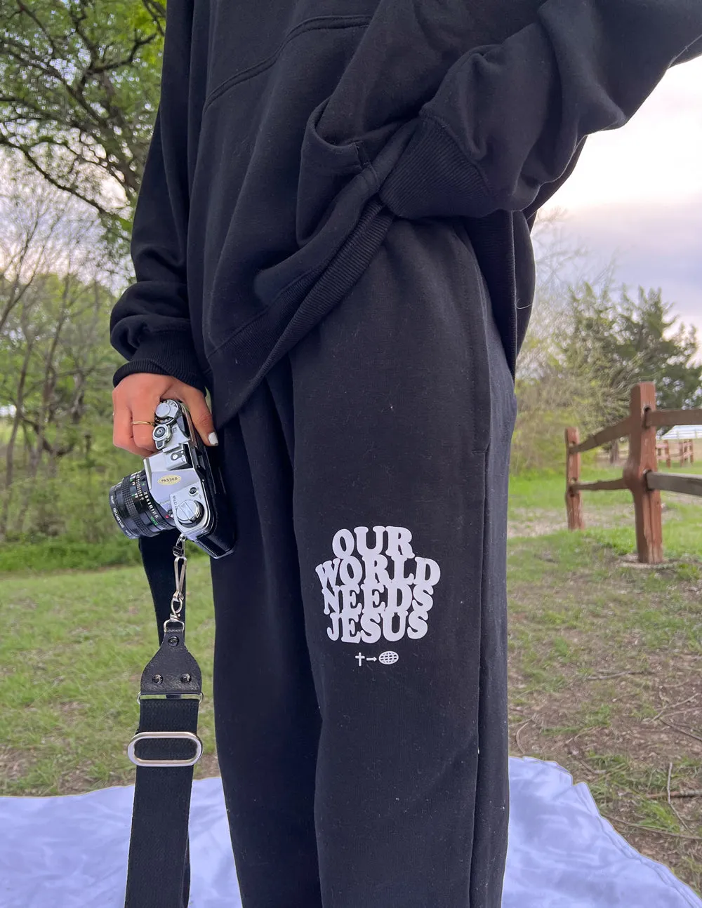 Our World Needs Jesus Black Unisex Sweatpant